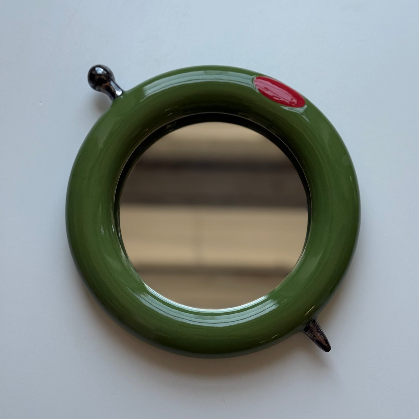 olive mirror with pick