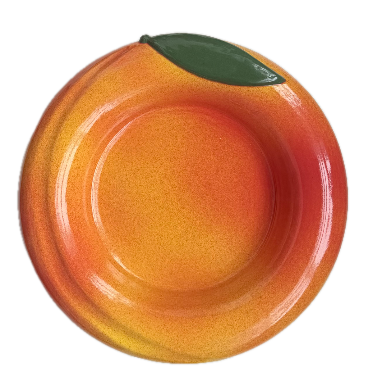Fruit-shaped bowl designed to look like a peach on a white background
