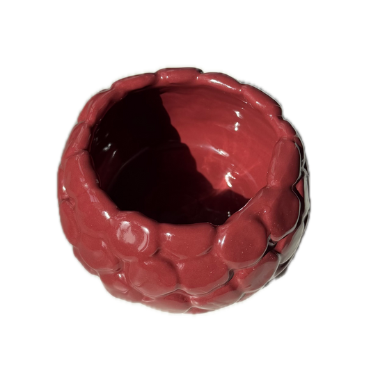 A glossy, raspberry shaped, textured ceramic bowl in a deep reddish-brown color, shown from a top-down perspective on a plain white background.